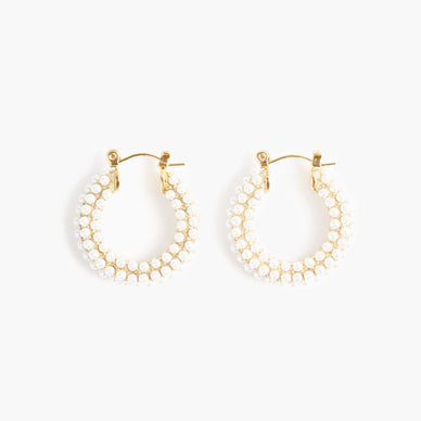 Fulfilled by our friends at Marrin Costello The It Hoop for girls that get it — meet our second edition of the Audrey Collection, detailed with ivory glass pearls. Available in both Hoop and Huggie sizes, this clickhoop earring is the statement you never knew you couldn't live without. Small in diameter but big in statement — Audrey is light (and small) enough to wear every single day, and yet sophisticated enough to rock with formal attire. Named one part for Ms. Hepburn herself and two part for Ms. Audrey Hope, the designer's soul coach and guest on Season 1 of the Marrin Costello Radio podcast — the Audrey's are stunning just as much as they are meaningful. From brunch to prom to bridal galore and everything in between — this hoop is not a want but a need. Click-back closure — for pierced ears 1" diameter *Please Note: Rewards cannot be applied to this product This item is not eligible for returns This item cannot be shipped outside the U.S.