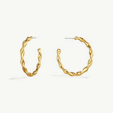 A modern, fresh take on the classic hoops reimagined in a new faceted twist design. Handcrafted by artisans in Kenya using traditional heritage techniques, 24K gold-plated or chrome-plated brass.
