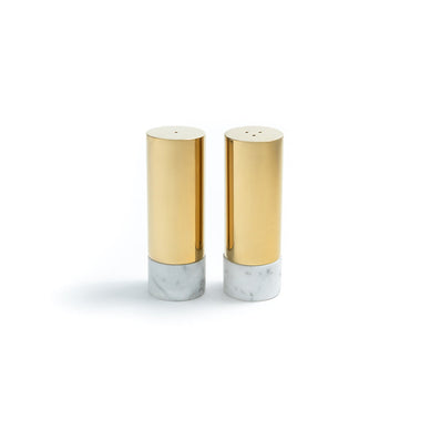 Our Coluna Dual Salt & Pepper Set, featuring a set of two plated stainless-steel shakers adorned with Carrara Marble and Gold elements, offers a modern and opulent touch to your dining experience. With their contemporary design and luxurious detailing, these shakers effortlessly blend functionality with style. Elevate your dining table with the modern elegance of Carrara Marble and the richness of Gold, transforming each meal into a sophisticated culinary affair. Set of 2 Italian Carrara Marble & Plated Stainless Steel Imported Each stone base is unique in color and pattern Wipe with soft, clean cloth as needed 1.25" x 1.25" x 3.5" / 3.2cm x 3.2cm x 8.9cm Made from Carrara Marble and adorned with Gold accents, our Coluna Dual Salt & Pepper Set brings a sense of tranquility to your table. Carrara Marble is renowned for clarity, while Silver promotes purification. Infuse each meal with balance and mindfulness as you sprinkle your favorite seasonings, elevating not just your dishes but your well-being. Fulfilled by our friends at ANNA New York *Please Note: Rewards cannot be applied to this product This item is not eligible for returns This item cannot be shipped outside the U.S.
