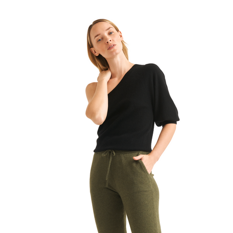 black one shoulder sweater on model