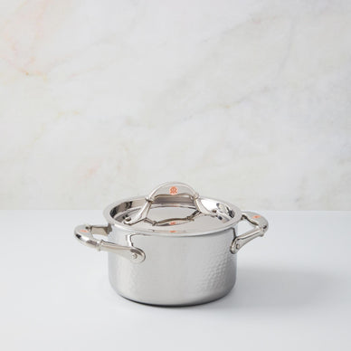 This small-yet-mightly saucepot is made from best-in-class clad stainless steel and features a super conductive aluminum alloy core, copper coin inlaid handles, and a mirror-polished lining for easy cleaning. 
Use this chef-quality saucepot for all your culinary adventures from poaching pears to simmering stock. 

Includes lid
Made in Italy
Capacity: 2qt
Oven and stovetop safe (up to 450˚F/320˚C)
Handwashing recommended
Induction compatible

*Ships separately from our friends at Ruffoni 

Please Note: Rewards cannot be applied to this product 
