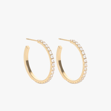 Meet your new best friend. Our most delicate geometric hoop to date is now embellished with dozens of simulated diamonds. Intricately detailed to make a big statement yet light enough to wear all day long, these beautifully crafted hoops are a must-add to your accessories collection. Available in 1" + 2" + 3" diameters — the Jay Hoops in Diamond are named after the designer's sister and fashion muse with her iconic effortlessly sophisticated fashion aesthetic. Fit for every single occasion — from every day wear to formal events. Bling on baby girl. 

Signature customer MC earring backings for extra comfort and security

Post-back closure — for pierced ears 
1" diameter
1.5mm simulated diamonds

Fulfilled by our friends at MARRIN COSTELLO 