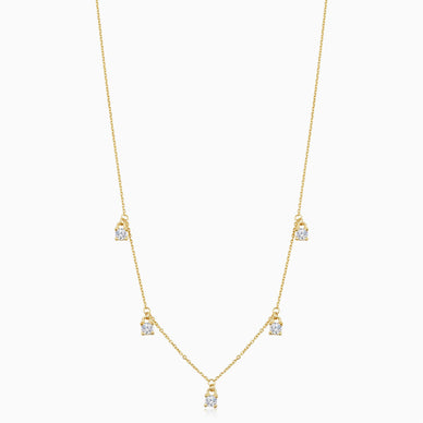 Add a bit of magic to your every day with the Seeing Sparks Dangle Necklace. Five glittery white topaz gemstones dangle from a delicate solid gold rolo chain. Wear it as a choker at 15" or layer it as a necklace at 17". However you wear it, it's timeless and charming, making it the perfect signature piece. 
The Finer Points: 

14k Yellow Gold
17 Inches Length, Adjustable to 15 Inches
1.5 Grams Solid Gold
Crafted in Vicenza, Italy

Ships separately from our friends at Oradina 
**Must order by 12/16 to guarantee delivery prior to 12/24 
