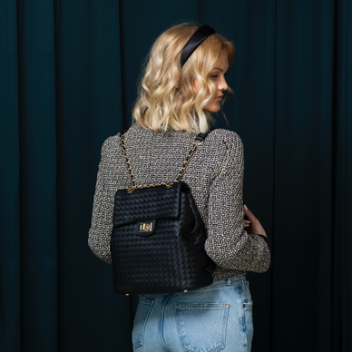 DIMENSIONS: 
9.5 IN WIDE X 5 IN DEPTH X 10.5 IN TALL 
Charlotte is a classic on the go. Smooth woven vegan leather, flap over entrance with a functional turn lock. chain top handle, smooth backpack straps. Interior zip pocket, Interior slip pocket. Cinching side snaps.  
Fulfilled by our friends at Kayla + Ava 