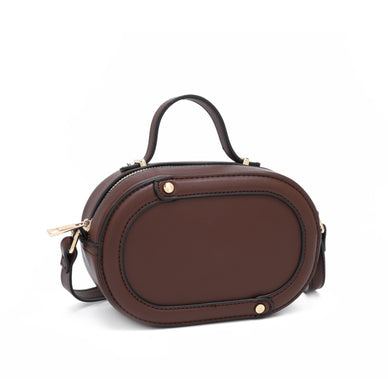 DIMENSIONS: 7IN LONG 5IN HEIGHT 3IN DEPTH 


Oval shape crossbody bag with piping detail. Detachable crossbody strap. Top handle with metal hardware tab detail. 
 


Fulfilled by our friends at Kayla + Ava


 
 
