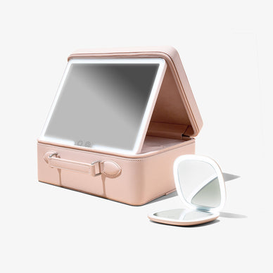 The ultimate vanity bundle has arrived for our glam girl on the go. Store, organize, and travel with all of your beauty essentials in your everything beauty bag, Baia. Baia is the portable vanity of your dreams! It has a detachable tri - light, dimmable LED makeup mirror, and multiple compartments to efficiently store makeup brushes, beauty tech devices, and various facial products. Baia also has a stretchy luggage strap to easily slide onto your carry on luggage for travel!  
If you are looking for a modern compact to keep in your bag for a night out or any daily touch ups, then you’ll love Moda. Moda has 3 light settings to accommodate all locations and is the perfect size to slip into any purse. Bring Baia and Moda with you, anywhere and your makeup and skincare will always be on point!\ Fulfilled by our friends at Vanity Planet 
 *Please Note: Rewards cannot be applied to this product This item is not eligible for returns 