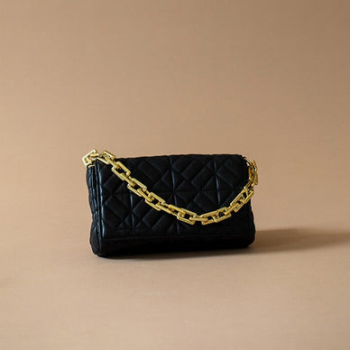 Fulfilled by our friends at Kayla + Ava DIMENSIONS: 
DIMENSIONS: 9.5IN LONG 5.5IN HEIGHT 2IN DEPTH 


Square flap crossbody bag with front chain detail. Chain can be worn on your shoulder or this is also accompanied by a detachable crossbody strap. Diamond shape quilted detail.
 




 
